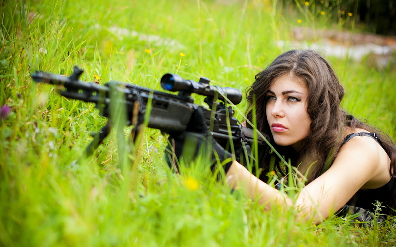 holding, selective focus, girl, lying down, weapons, background, one person, weapon, men, beautiful woman, plant, young adult, aiming, armed forces, outdoors