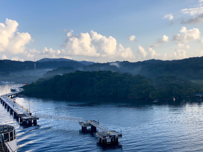 nature, water, nautical vessel, weather, vehicle, land, mode of transportation, waterfront, ocean, dock, tree, port, river, tranquil scene, vessel, mountain