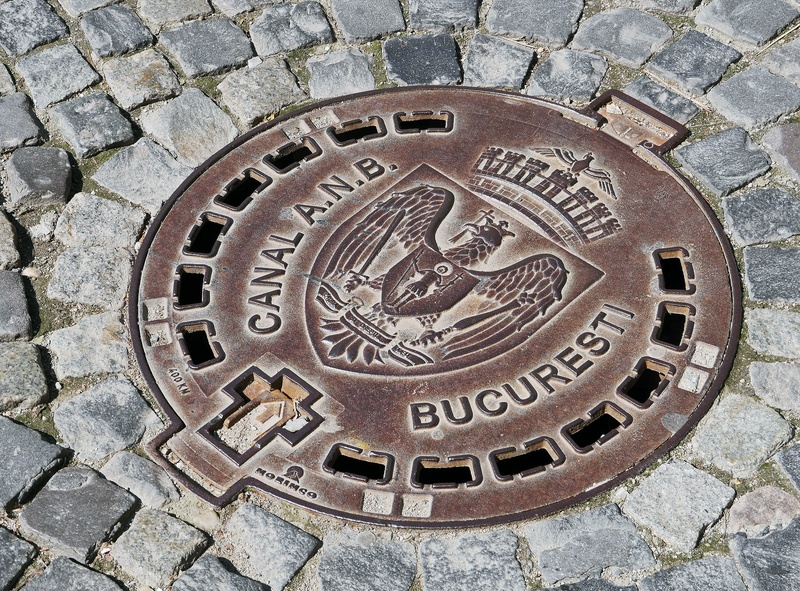 no people, day, channel, footpath, high angle view, circle, text, craft, directly above, old town, sewer, city, geometric shape, communication, pattern