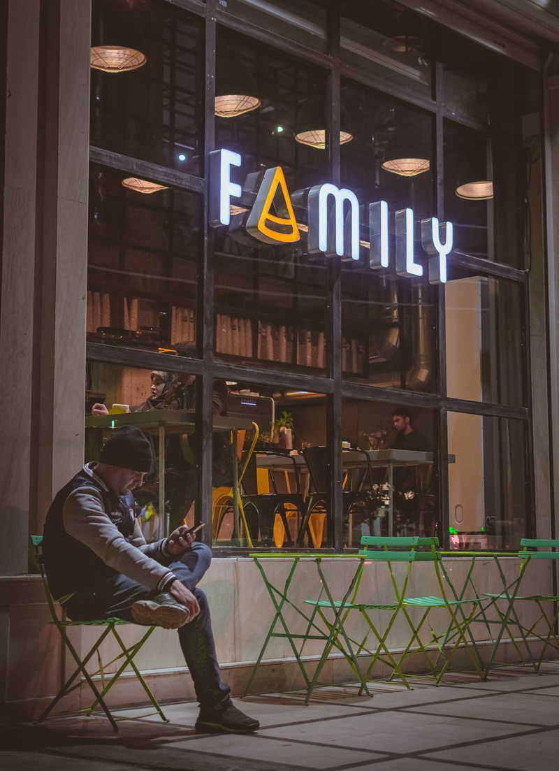 chair, building exterior, using, man, banister, shop, full length, sitting, outdoor, sign, food, window, 4K, family café ans restaurant, built structure