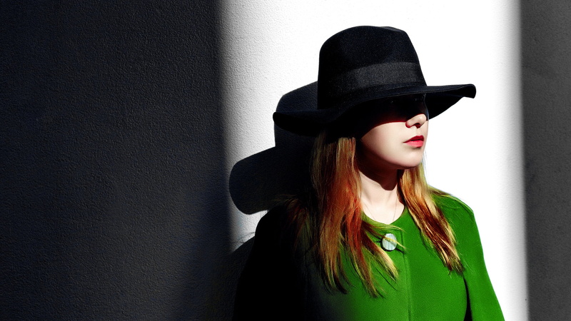 indoors, 1080P, clothing, one person, hairstyle, hair, green coat , wall - building feature, portrait, fashion, headshot, face, young women, hat, front view