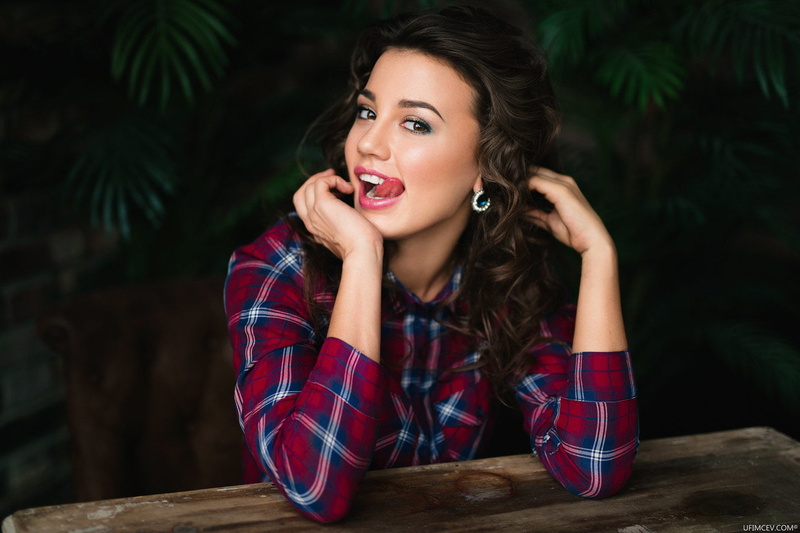 front view, hairstyle, tongues, Alexander Ufimtsev, real people, young adult, table, happiness, adult, sitting, looking at camera, emotion, portrait, smiling
