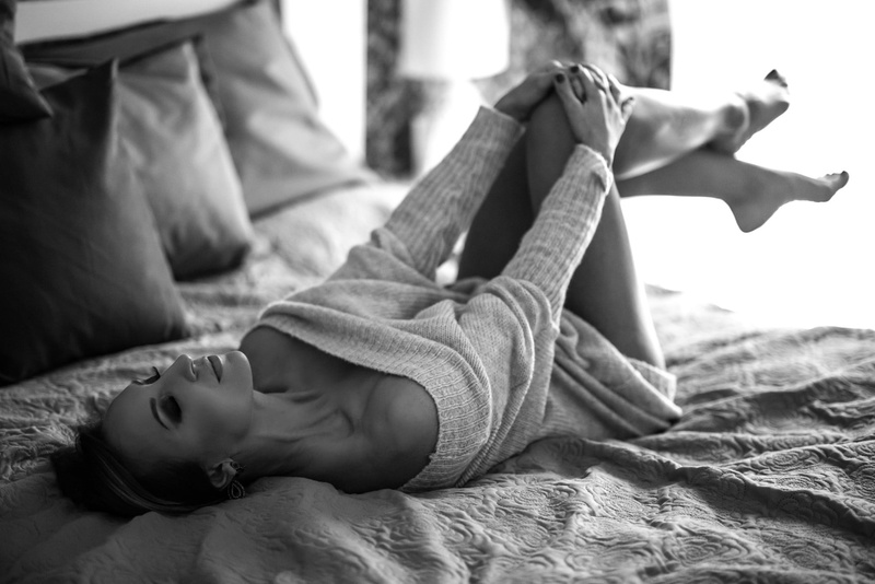 in bed, monochrome, real people, lying on back, comfortable, smoky eyes, bare shoulders, holding knees, furniture, relaxation, 1080P, young adult, closed eyes