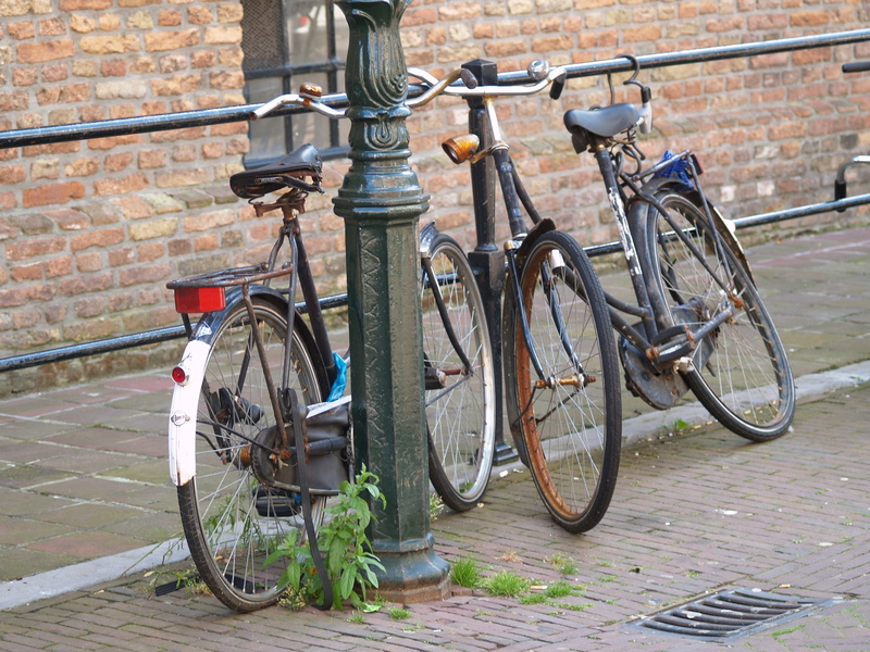 mode of transportation, city, Bike, metal, sidewalk, building exterior, saddle, Amsterdam, Netherlands, architecture, stationary, railing, no people, wall - building feature
