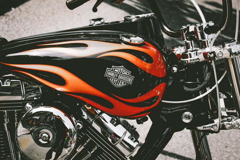 orange color, harley, headlights, red, focus on foreground, motor, day, machine, outdoors, stationary, road, headlight, wheel, close-up, bicycle, metallic