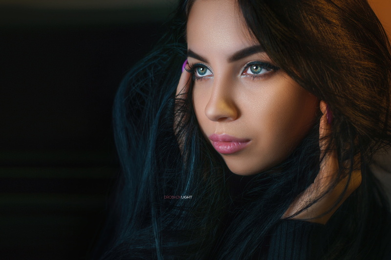 model, touching face, face, depth of field, dark, looking away, portrait, painted nails, long hair, indoors, Alexander Drobkov, women, women indoors, sweater