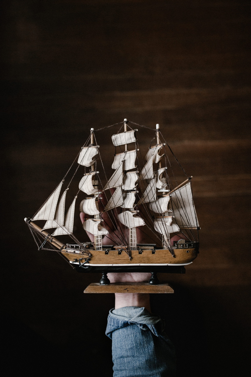 galleon, security, art and craft, white, transportation, mode of transportation, clothing, paper currency, holding, wooden, spirituality, person, no people