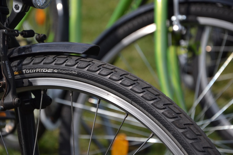 close-up, spokes, nature, outdoors, focus on foreground, black color, selective, stationary, land vehicle, parking, black, photo, travel, wheels, inner tubes
