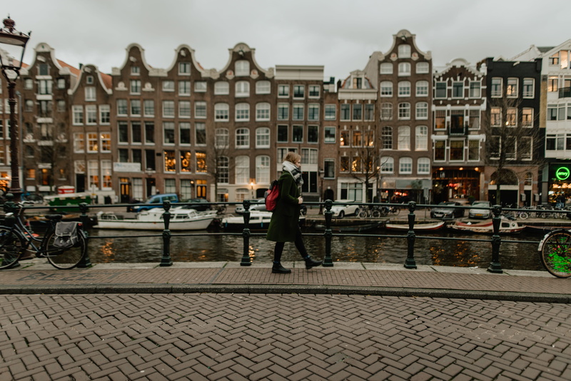 street, bicycle, lifestyles, canal, men, boat, wheel, amsterdam, town, pedestrian, outdoors, city, full length, walkway, beside, architecture, downtown