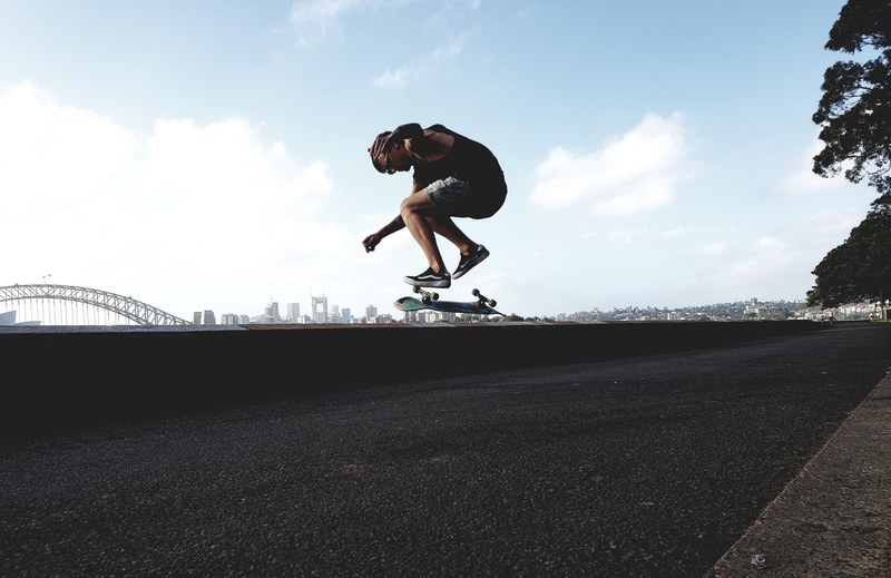 guy, trick, motion, enjoyment, outdoors, clouds, stunt, pavement, skateboarder, young adult, lifestyles, skate, leisure, man, fun, person, action, mid-air