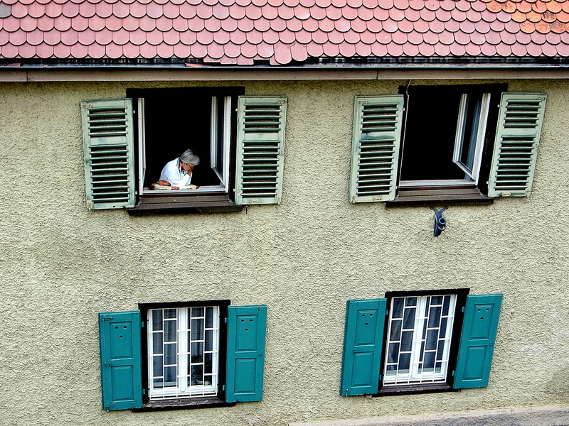 house, window frame, woman, safety, architecture, security, built structure, day, urban, outdoors, window, low angle view, watch, wall - building feature