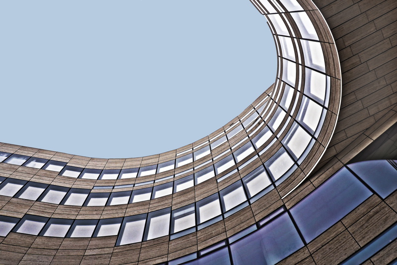 office building exterior, kö bow, glass - material, contemporary, view, eye, office, pattern, modern architecture, clear sky, futuristic, sunlight, directly below