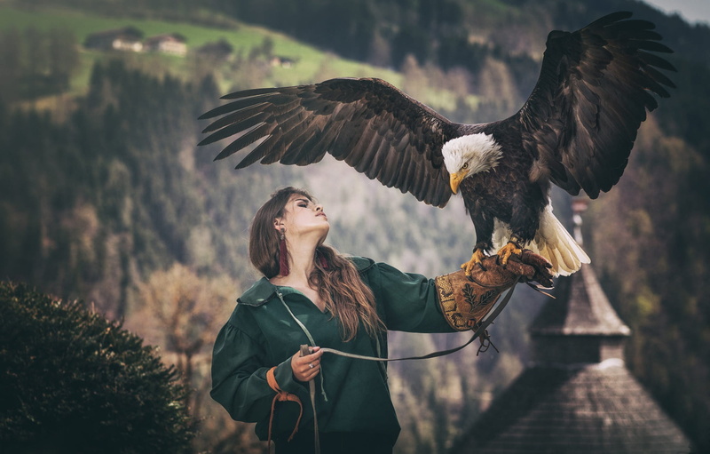 1080P, long-haired, nature, pet, glove, brown hair, bald eagle, portrait, pose, the dark background, hands, girl, jacket, wings, bird, eagle, predatory