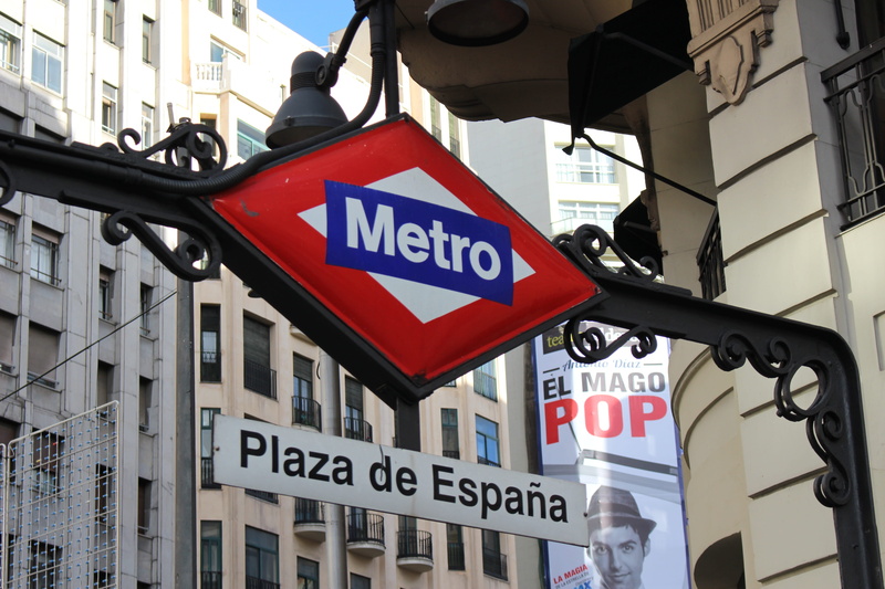 city, outdoors, low angle view, capital letter, road, guidance, road sign, Madrid, urban, built structure, 5K, architecture, travel, lighting equipment