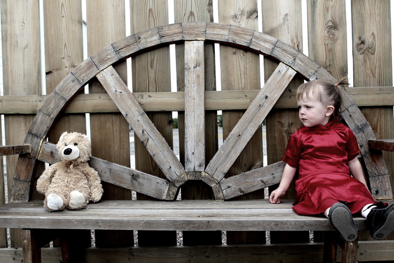 plush, seat, innocence, red, toy, children only, little, lifestyles, outdoor, full length, teddy, females, girl, adult, dress, girls, built structure, young