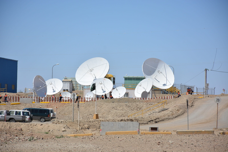 built structure, satellite antenna, satellite, alternative energy, men, white color, sunlight, outdoors, technology, architecture, fuel and power generation