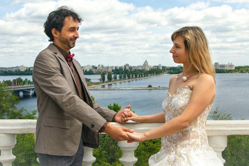 the groom, standing, emotion, smiling, couple, positive emotion, family, city, young women, two people, mood, couple - relationship, wedding, sea, fidelity