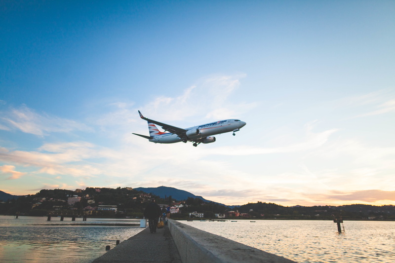 commercial airplane, 5K, sky, airline, motion, blue, white, bridge, trip, journey, nature, day, mode of transportation, sea, ocean, cloud - sky, built structure