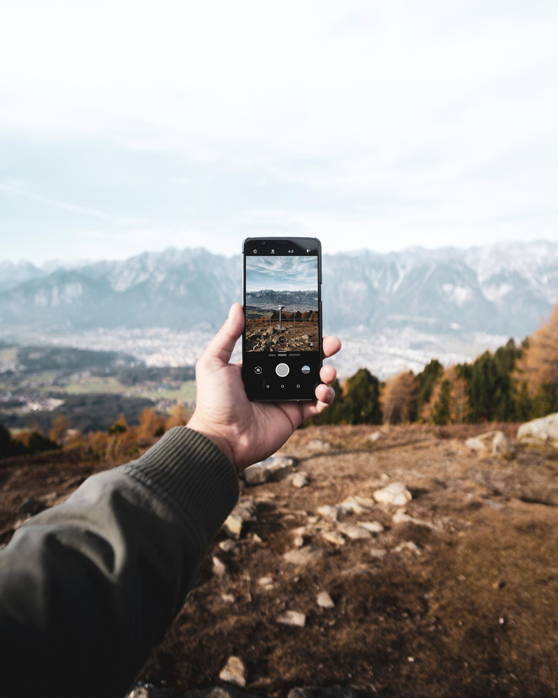 2K, technology, taking, lifestyles, outdoor, hand, outdoors, mountain, orange, hiking, wood, personal perspective, outside, real people, leisure activity