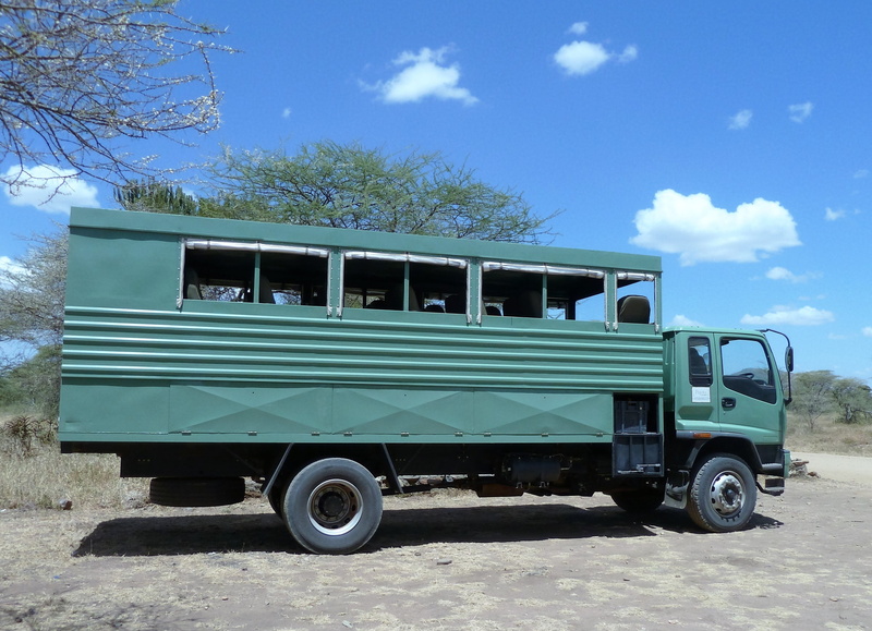 land vehicle, blue, land, mode of transportation, tree, outdoors, parking, 2K, motor vehicle, nature, day, road, jeep, sky, africa, pick-up truck, sunlight
