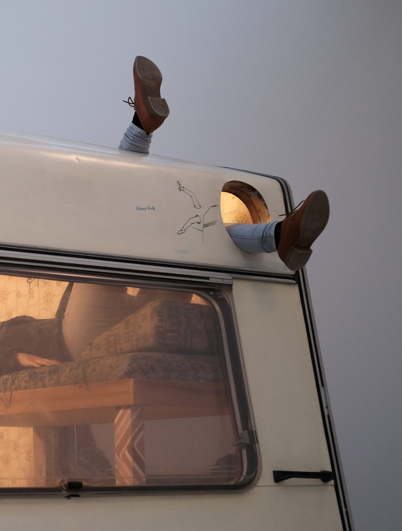 car, day, mirror, inside, window, motor vehicle, glass - material, person, bed, road, feet, mode of transportation, campervan, motorhome, food and drink