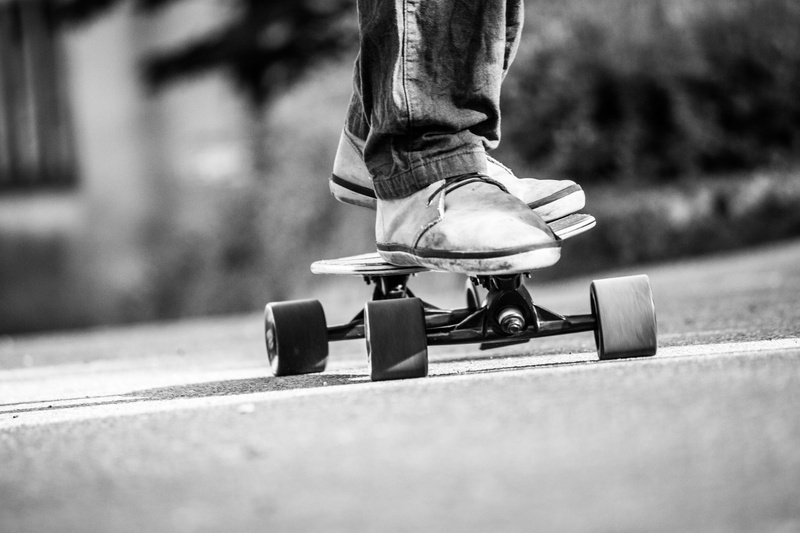 city, young man, a, day, sunlight, shoes, skateboard, pants, trend, human limb, one person, standing, unrecognizable person, longboard, quiksilver, fashion