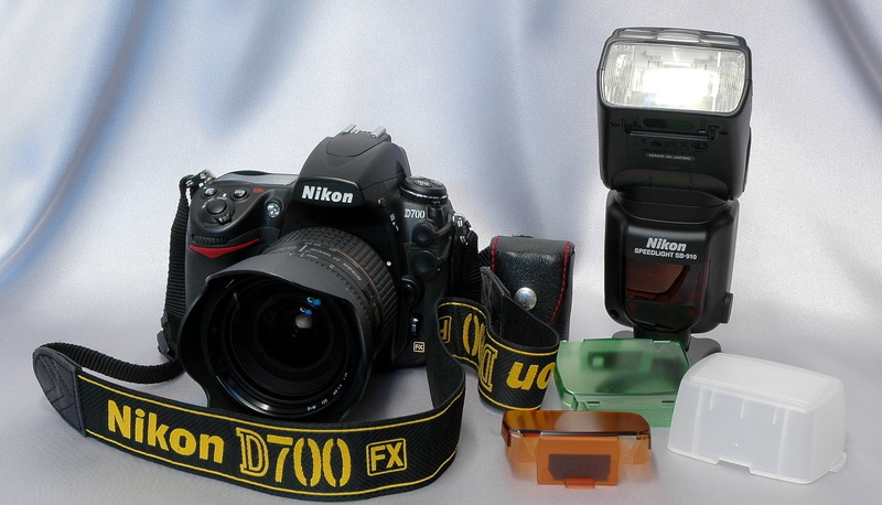 the camera, strap, Nikon D-700 FX, lens AF Nikkor 24-85 f/2.8-4 D, 1080P, flash Nikon Speedlight SB-910, mirror, background, professional