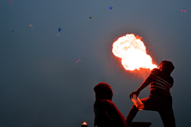 nature, firebolwing, motion, fire, heritage, lifestyles, real people, crazy, men, holding, flame, silhouette, firespinnig, people, blowing, outdoors, man