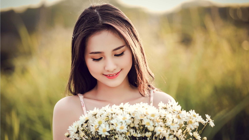 hair, plant, beauty, woman, flowering plant, happiness, flower, women, beautiful people, nature, white, daisy, girl, hairstyle, young adult, headshot, contemplation