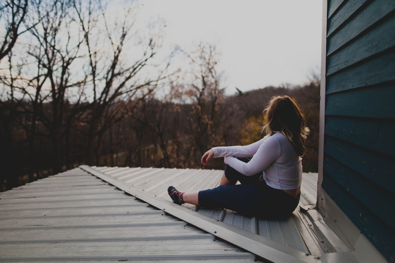 houses, outdoors, women, casual clothing, one woman only, adults only, people, woman, young Adult, real people, tree, leisure activity, full length, sweater