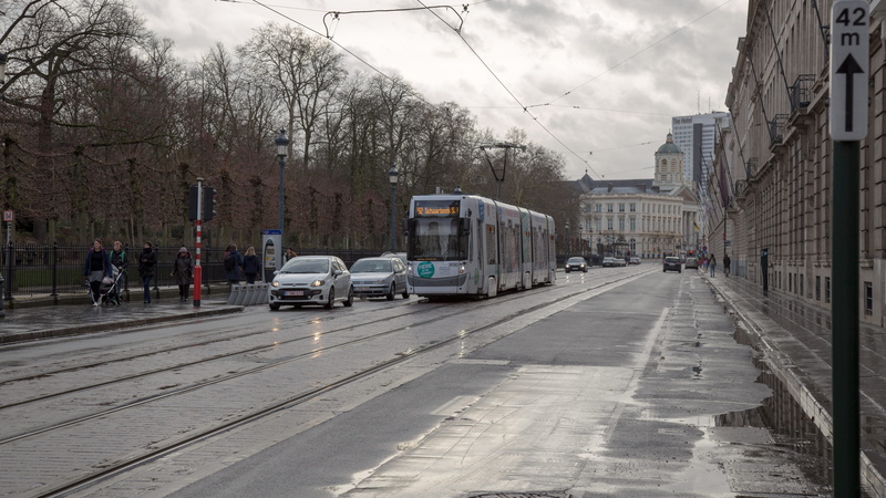 incidental people, architecture, sky, bus, direction, rail transportation, city, street, nature, streetcar, cable car, track, cloud - sky, trolley, automobile