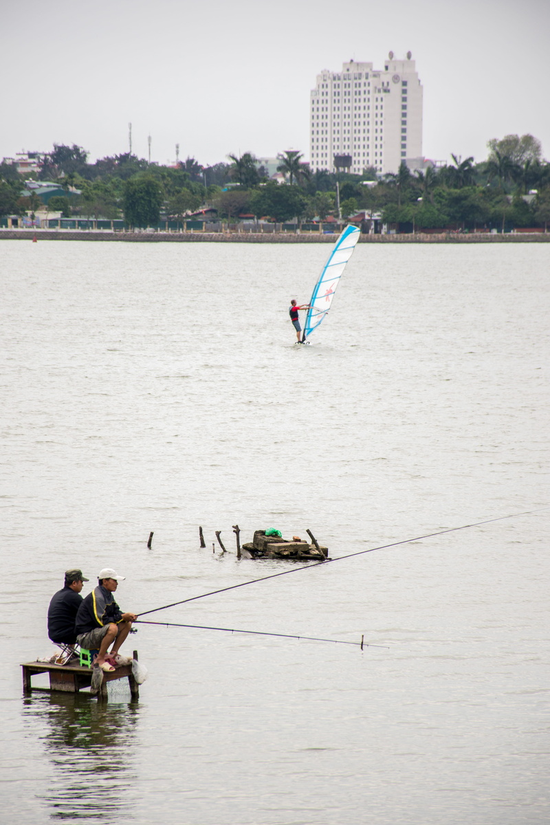 building exterior, lake, surfing, water, nautical vessel, architecture, outdoors, vietnam, 5K, nature, group of people, wave, men, day, west lake, landscape