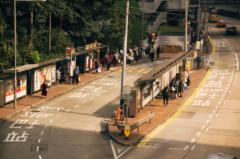 architecture, highway, transportation, terminal, vehicle, outdoors, zebra crossing, path, day, 5K, tarmac, land vehicle, furniture, road, human, large group of people