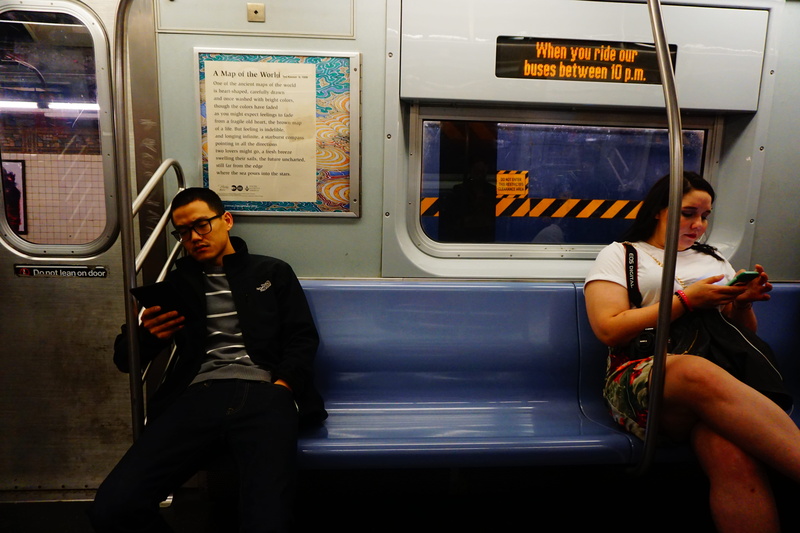 bus, sitting, real people, land vehicle, subway, cushion, vehicle, lifestyles, handrail, clothing, train, overcoat, human, pants, public transportation
