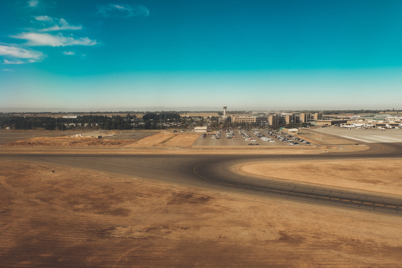clear sky, scenics - nature, sky, city, day, parking lot, construction site, transportation, trip, 4K, sunshine, landscape, sunlight, road, airplanes