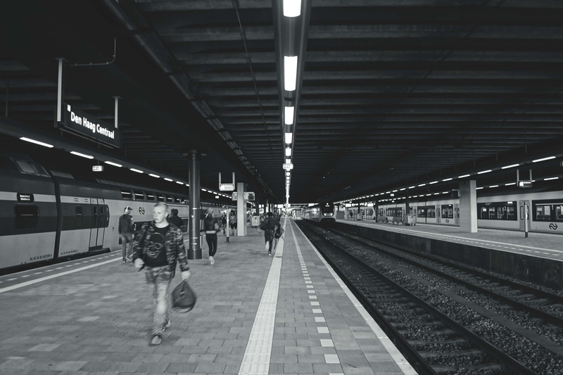 business, adult, illuminated, steel, real people, railroad station, lifestyles, railroad station platform, transportation, indoors, locomotive, ceiling