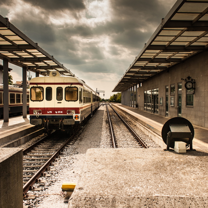 rail transportation, architecture, land vehicle, railroad track, public, journey, cloudy, travel, transportation, train - vehicle, no people, built structure