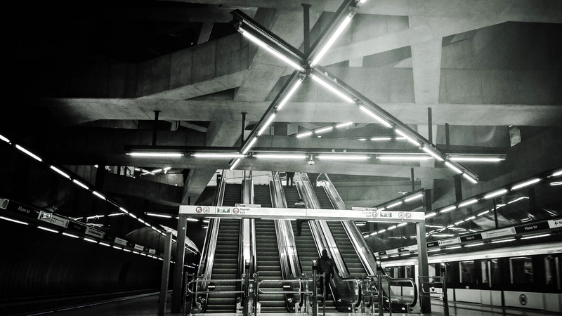 2K, vehicle, rail transportation, architecture, station, people, factory, metro, black-and-white, building, travel, industry, transportation system, reflection
