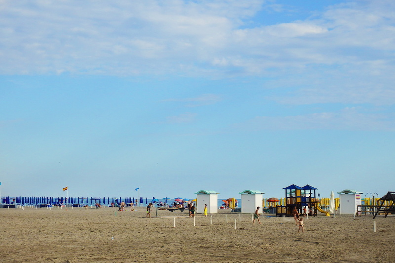 beauty in nature, sky, italy, friuli, sand, beach umbrella, large group of people, cloud - sky, travel, holiday, incidental people, day, grado, water, blue