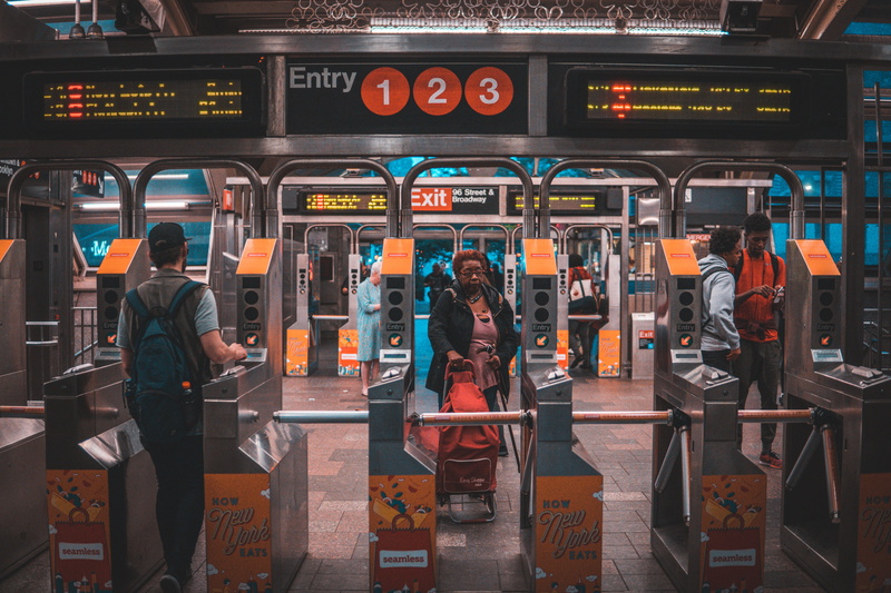 western script, mode of transportation, text, red, woman, 5K, city, station, railroad station, real people, city life, men, standing, architecture, pulling