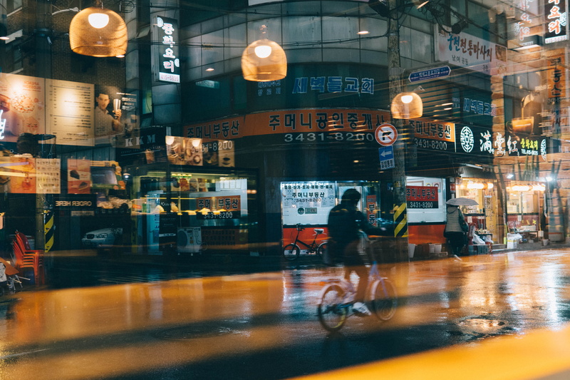 glass - material, human, bicycle, transportation, seoul, handrail, incidental people, night, lighting equipment, group of people, riding, vehicle, restaurant
