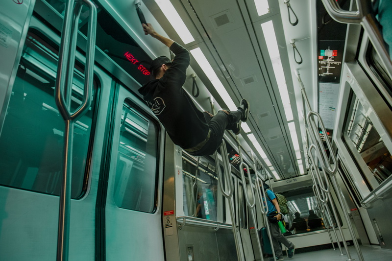lifestyles, mode of transportation, black, vehicle interior, train, denver, low angle view, one person, hanging, public transportation, denver international airport