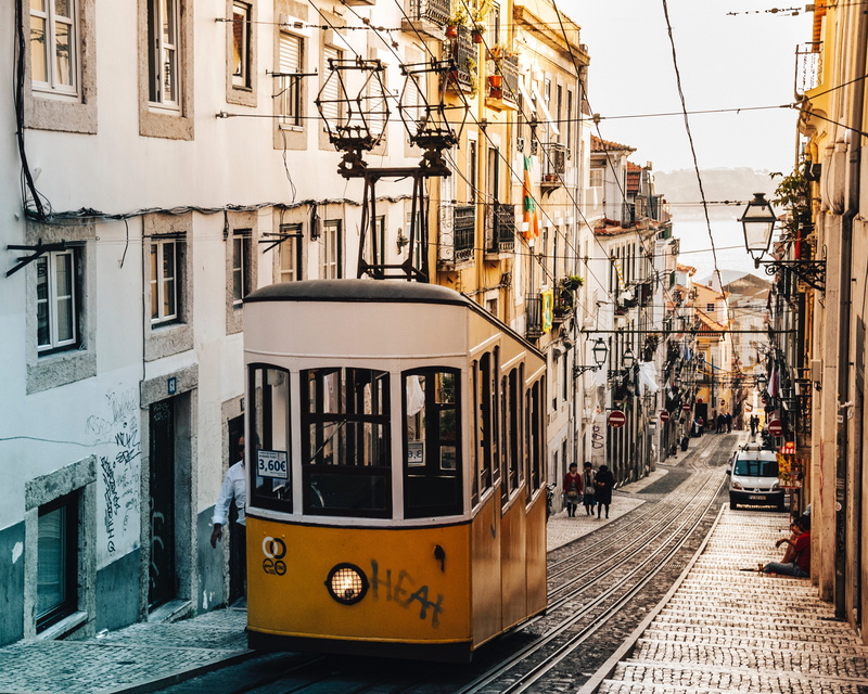 transportation, outdoors, no people, street car, incidental people, train, residential district, trolley, building exterior, mode of transportation, track