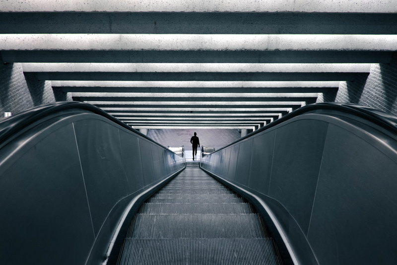 one person, real people, rear view, station, built structure, the way forward, on the move, person, staircase, lifestyles, architecture, railing, men, blackandwhite