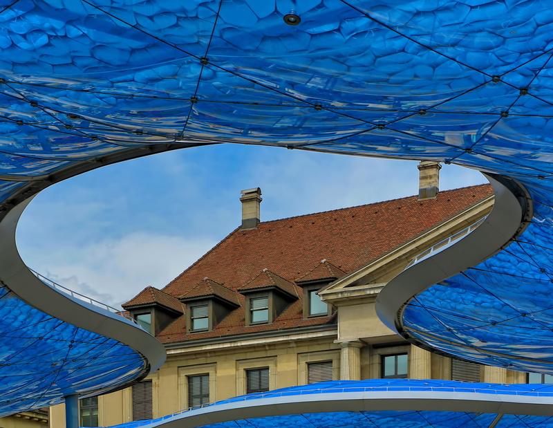 house, sunlight, geometric shape, shape, deck, low angle view, inflatable, day, station, built structure, tile, contrast, building, old and new, composition
