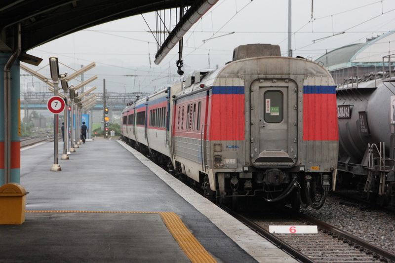 cargo, car, bus, train station, korea, rail transportation, commuter train, passenger train, land vehicle, shipping, transportation, railroad station, railroad track