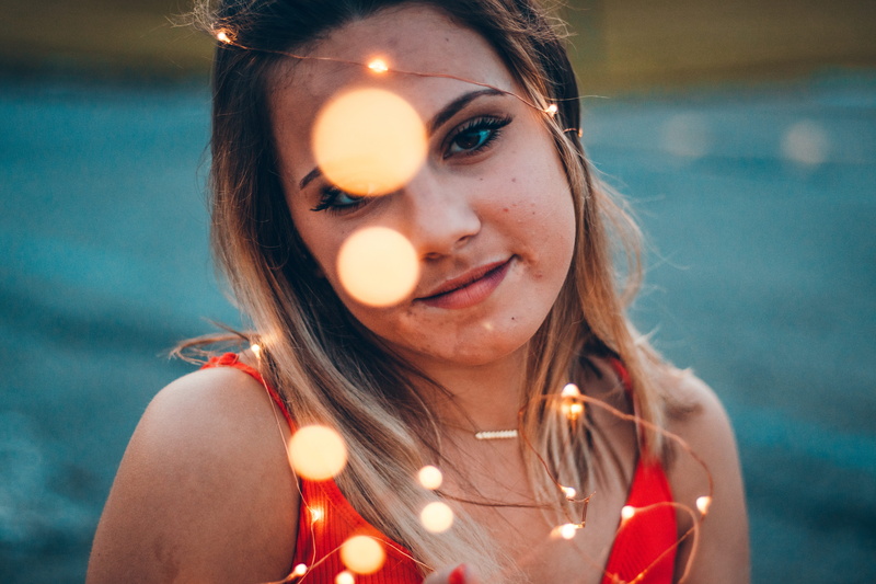 strap, twinkle, shallow, string lights, creme, person, headshot, portrait, flame, girl, dessert, focus, light, bokeh, human, young adult, food, diwali