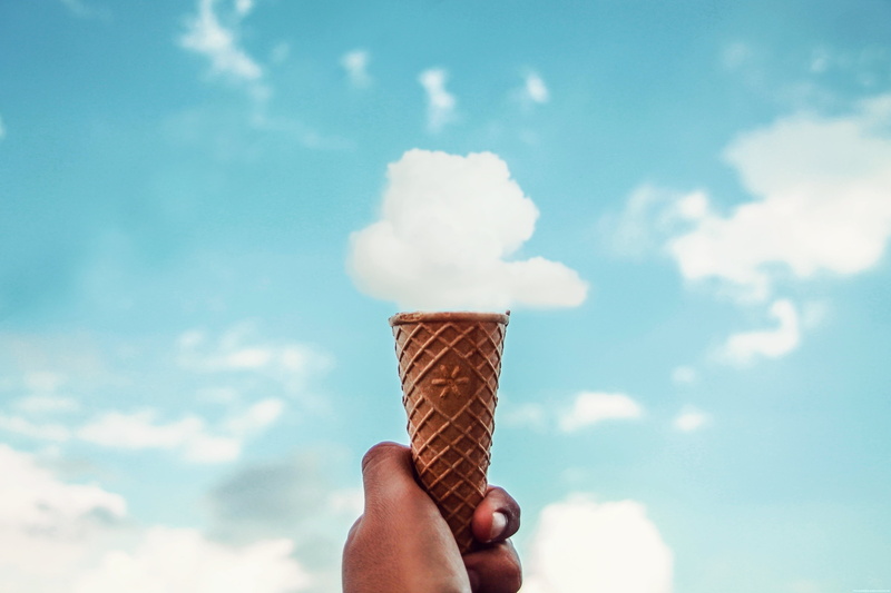 brown, outdoors, frozen sweet food, sweet, human limb, sky, ice cream cone, personal perspective, body part, finger, indulgence, cone, temptation, sweet food