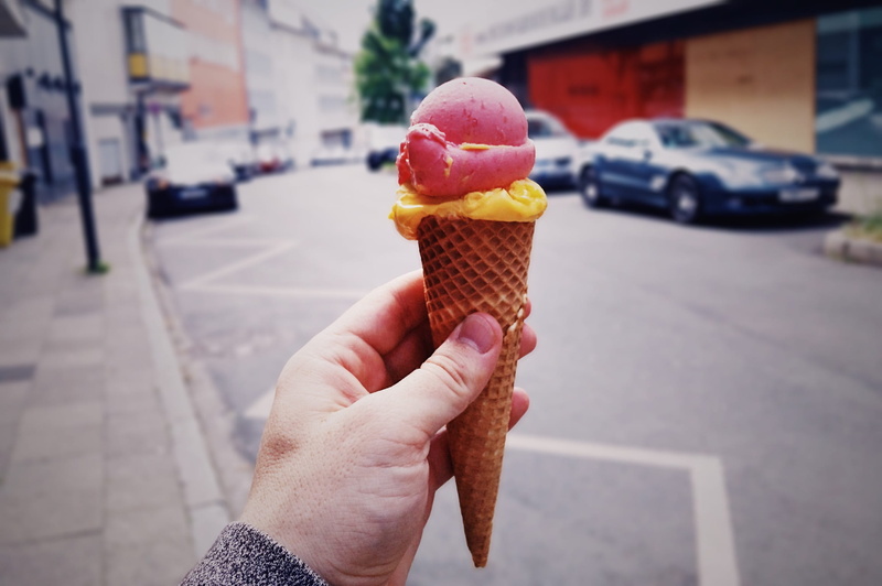 holding, sugar, ice, person, food and drink, unhealthy eating, sweet food, sweet, cream, yellow, hand, ice cream cone, finger, body part, summer, outdoors