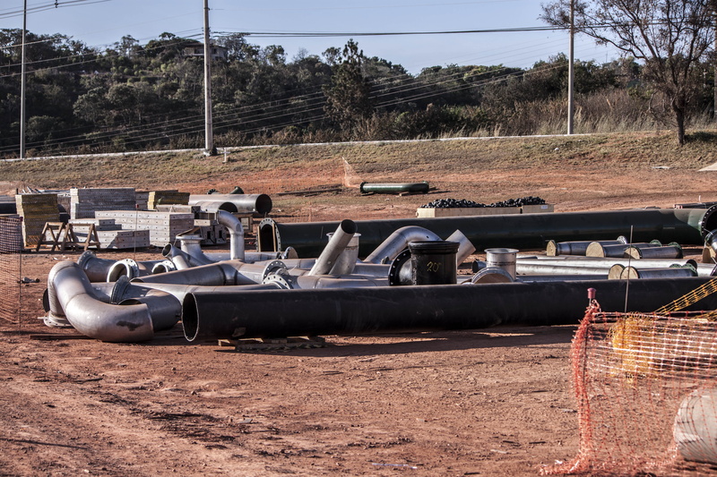 construction site, engine, no people, day, power, sky, dirt, industry, damaged, abandoned, land, mode of transportation, metal, construction, blue, sunlight